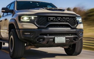 Ram 1500 driving down a road